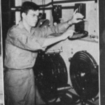 Student_adjusts_projector_in_Auditorium_41.jpg